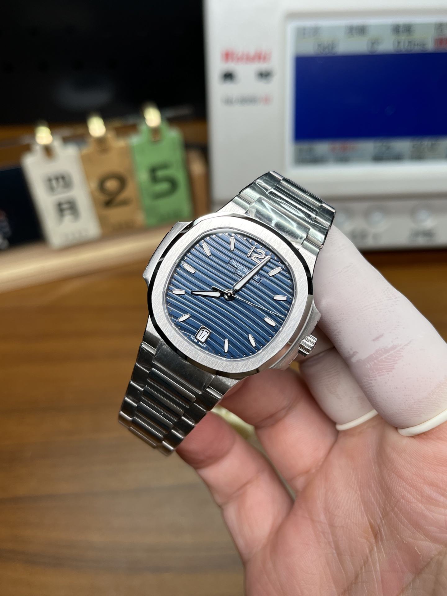 Patek Philippe Nautilus replica blue dial front view with stainless steel bracelet