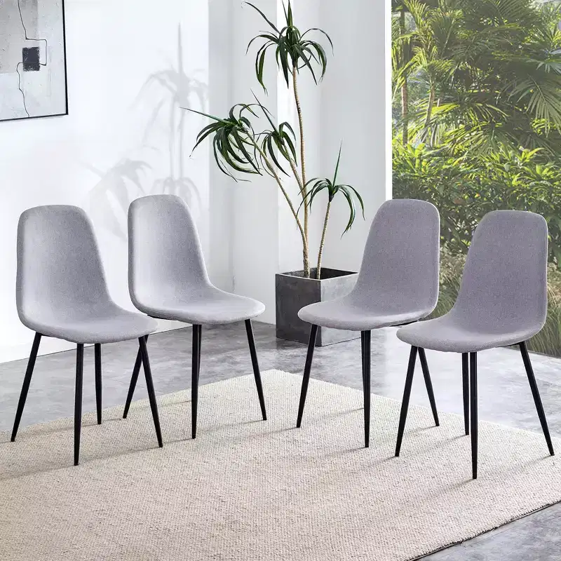 A set of 4 grey fabric-backed and metal combination spoon chairs - a perfect match for minimalist and Scandinavian-style home decor