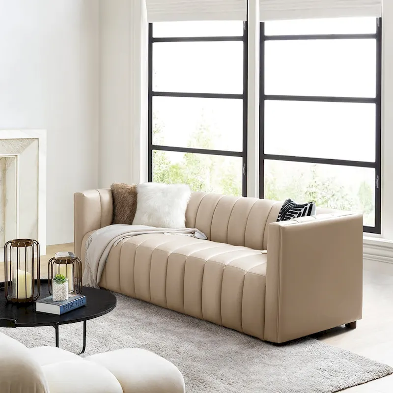 83-inch genuine leather curved sofa with a grooved backrest.