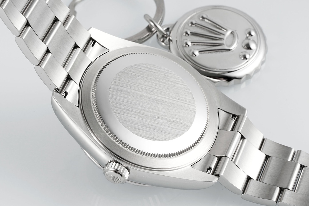 Back view of the replica Rolex Sky-Dweller showing screw-down case back with brushed finish and Oyster bracelet links
