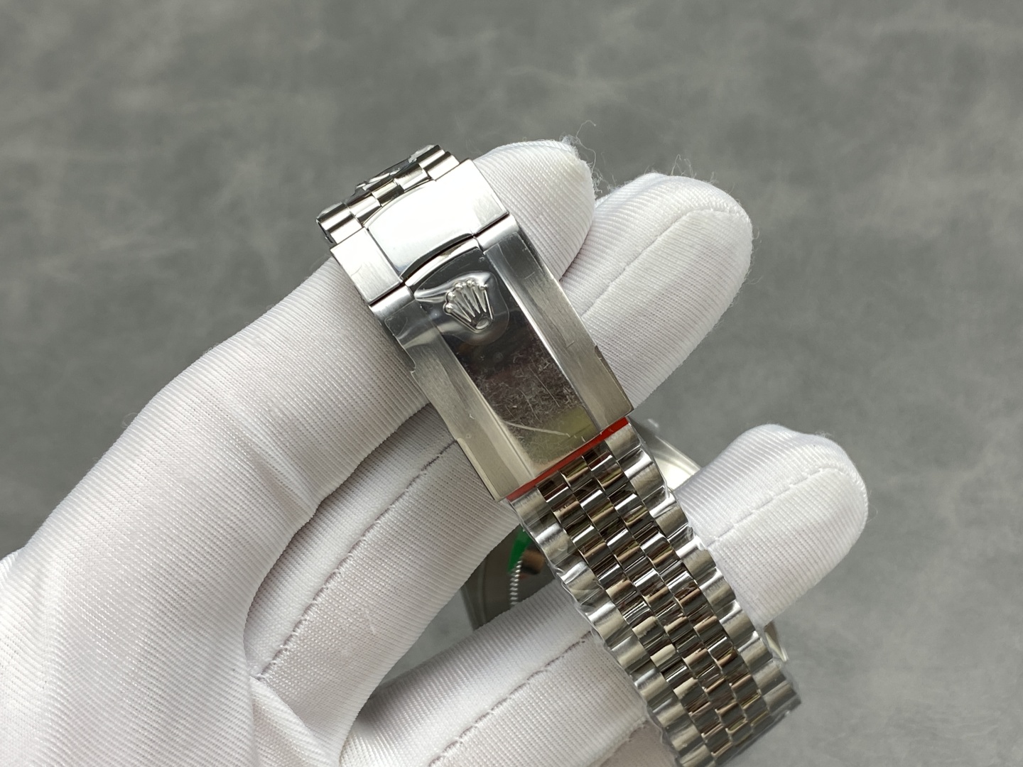 Jubilee bracelet and Rolex crown clasp with red protective sticker