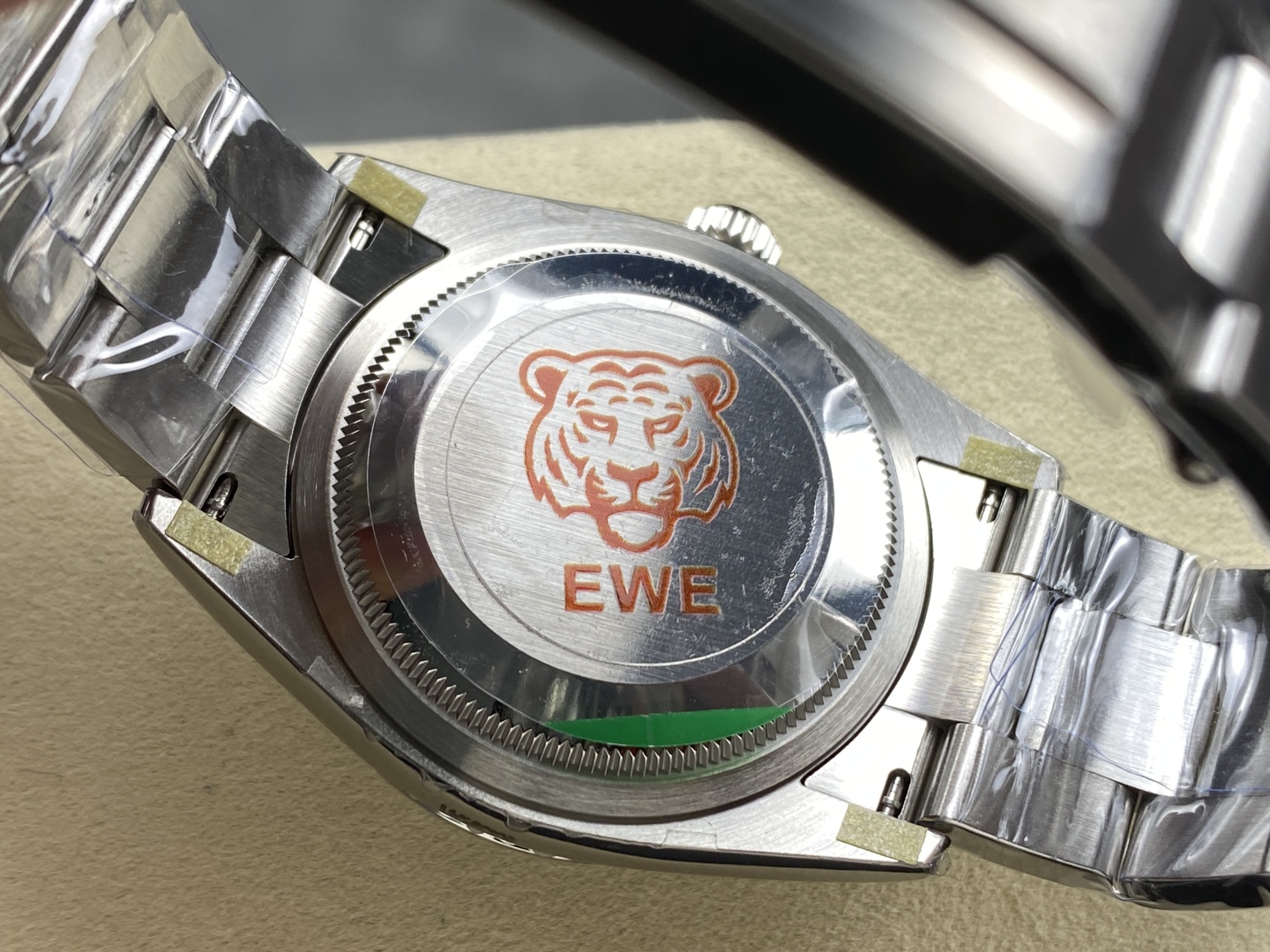 case back of quality rolex replica with EWE tiger emblem