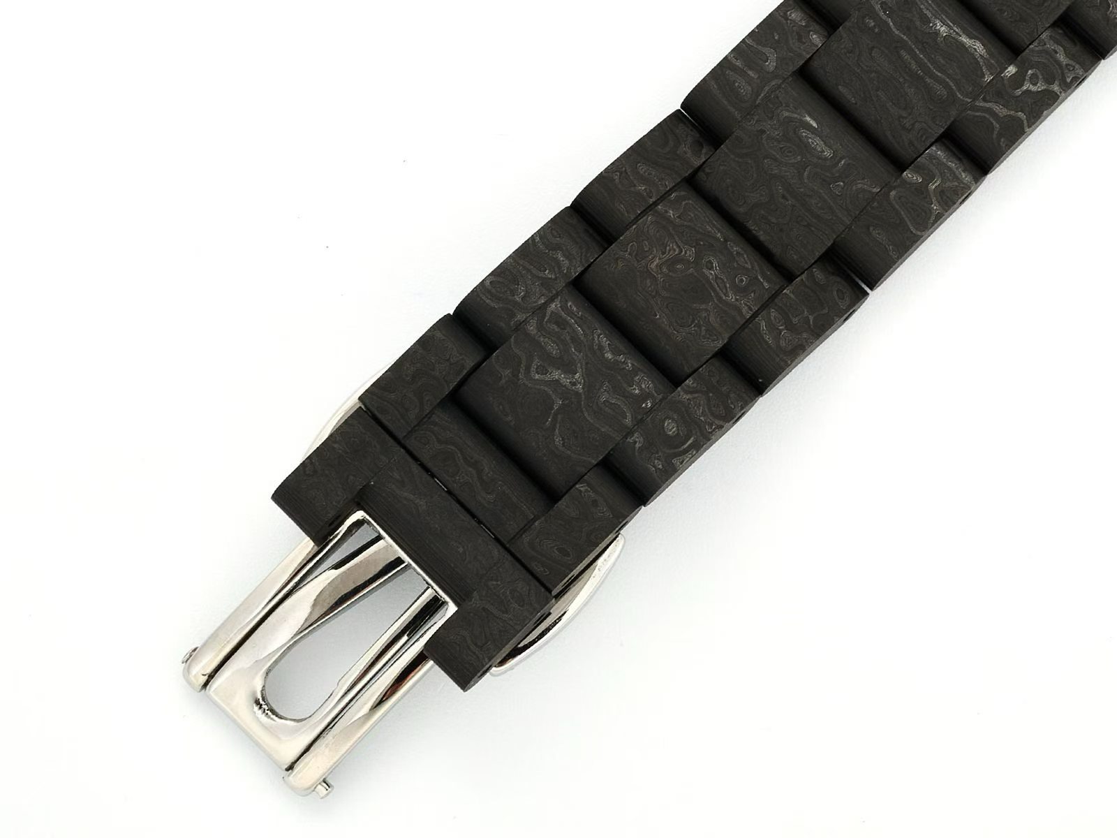 Folding clasp close-up on black carbon fiber bracelet