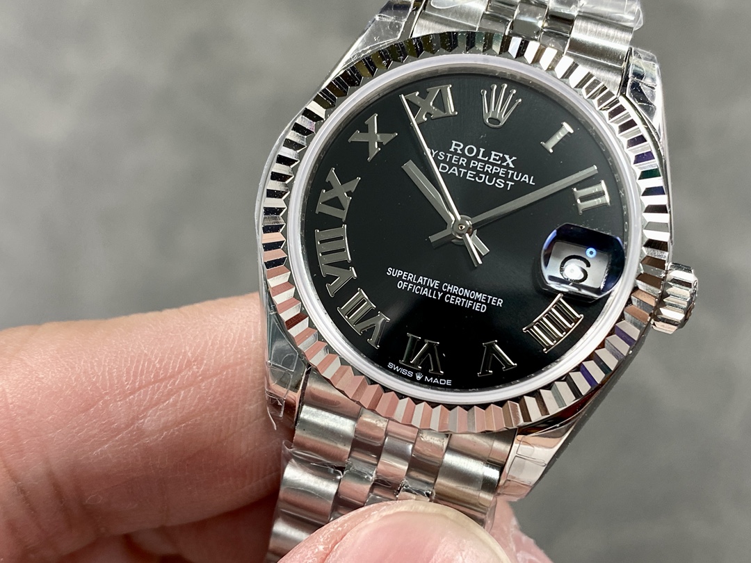 close-up of fake rolex datejust black dial roman numerals fluted bezel
