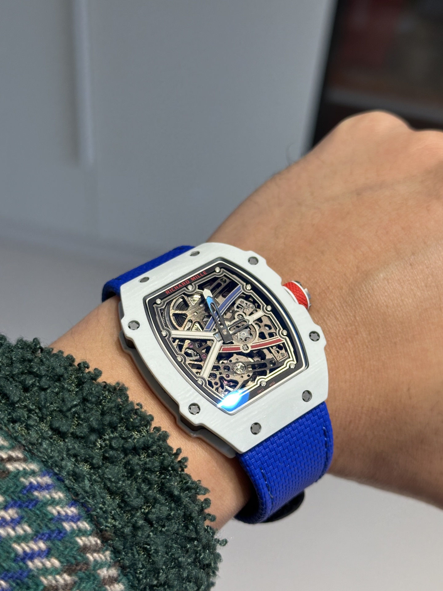 Replica Richard Mille watch on wrist with blue strap in natural wear test
