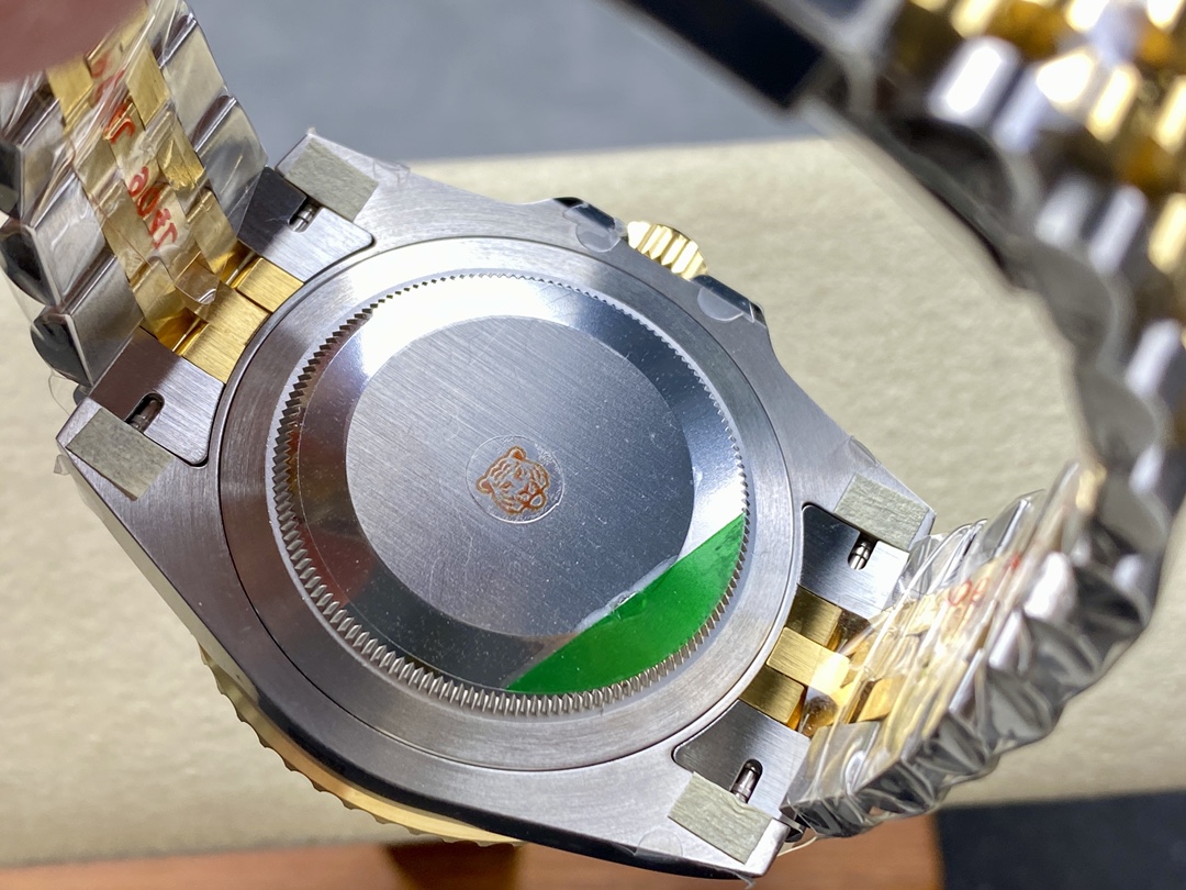 Brushed stainless steel case back of the replica watch with engraved tiger logo and quality sticker, secured with screw-down design