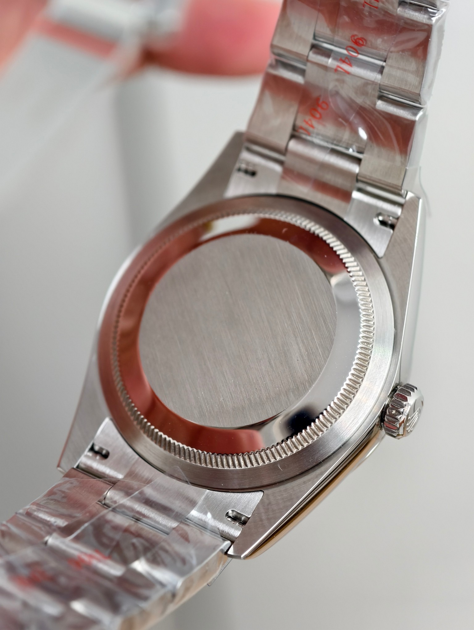 Rear view of Rolex replica caseback showing brushed finish and crown