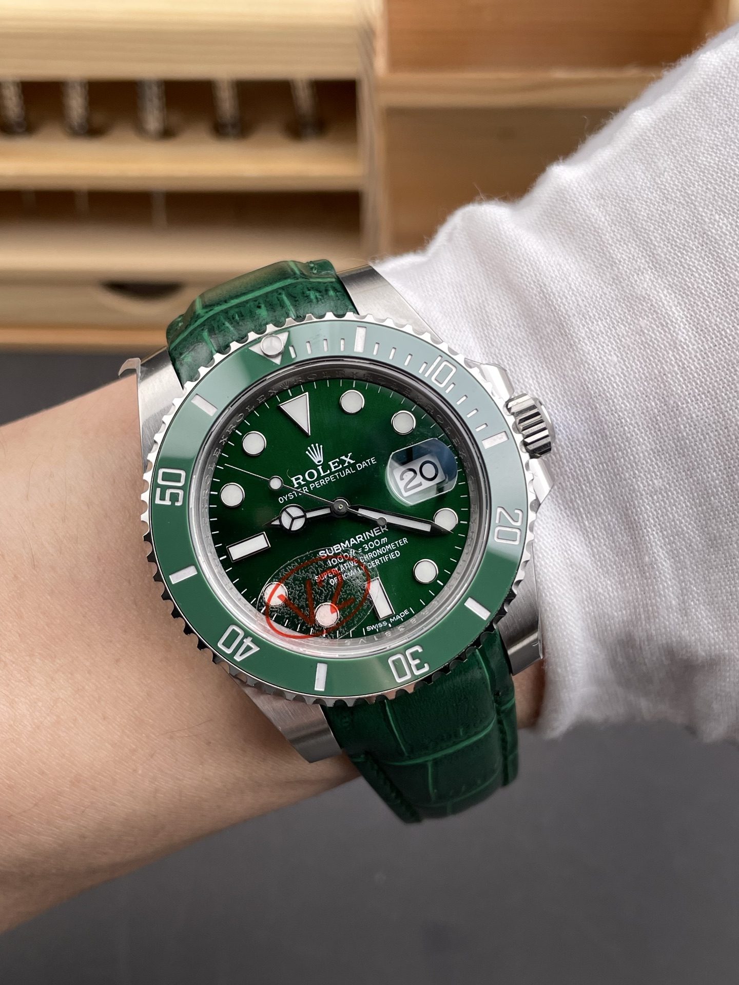 Green Rolex Submariner replica on wrist angle view