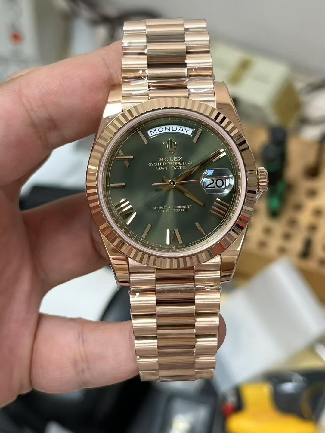Rolex Day-Date rose gold replica with green dial and fluted bezel