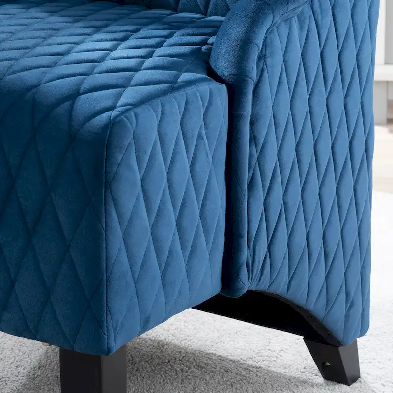 High-backed velvet wing-back chair with wooden legs