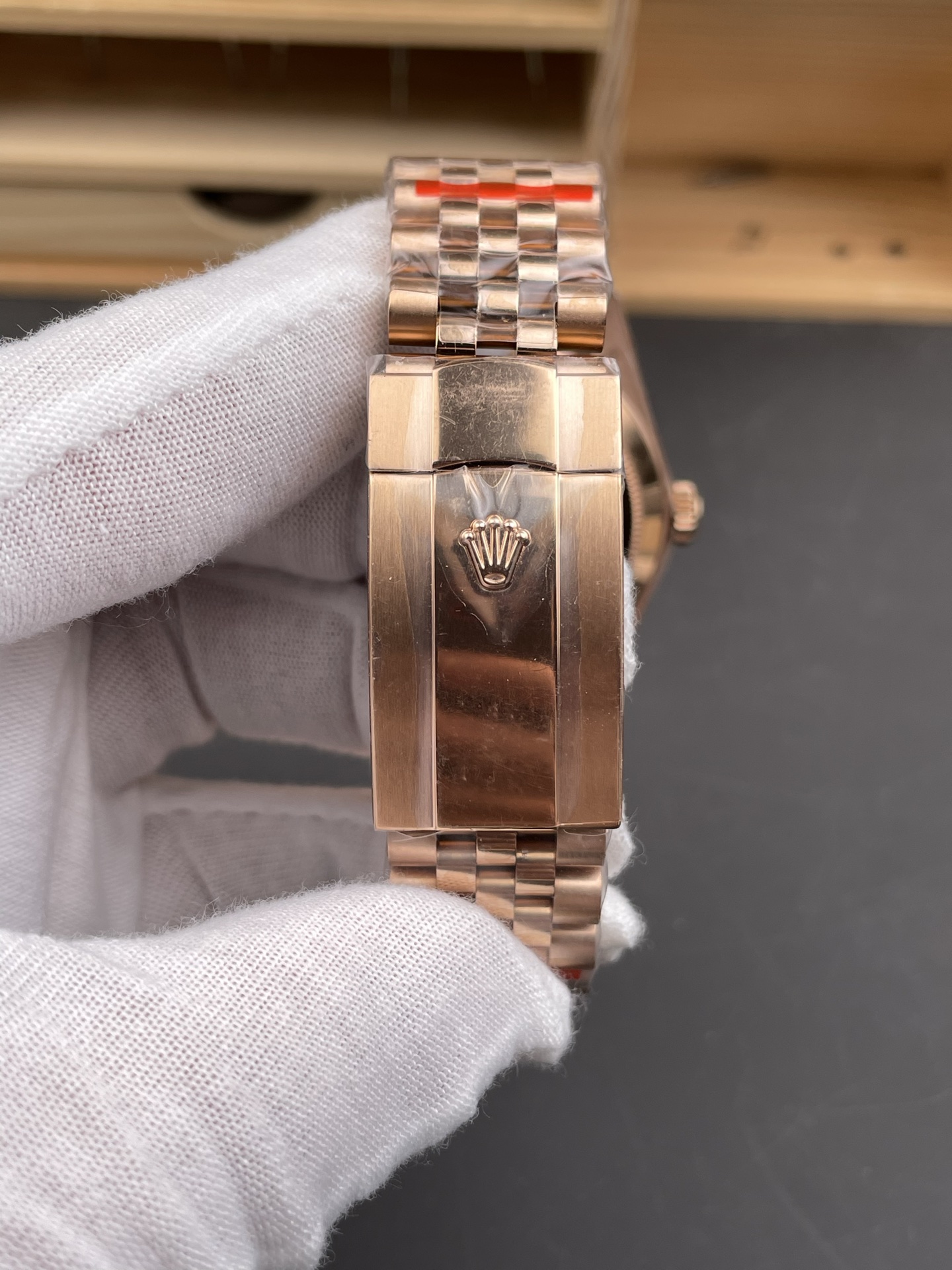 Rose gold Rolex replica clasp exterior with Jubilee bracelet and crown logo