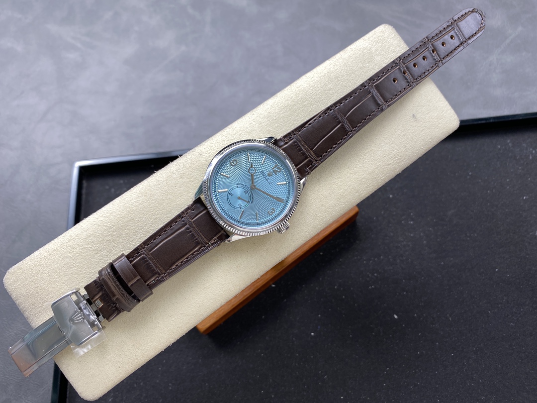 Replica Rolex ice blue dial leather strap flat lay