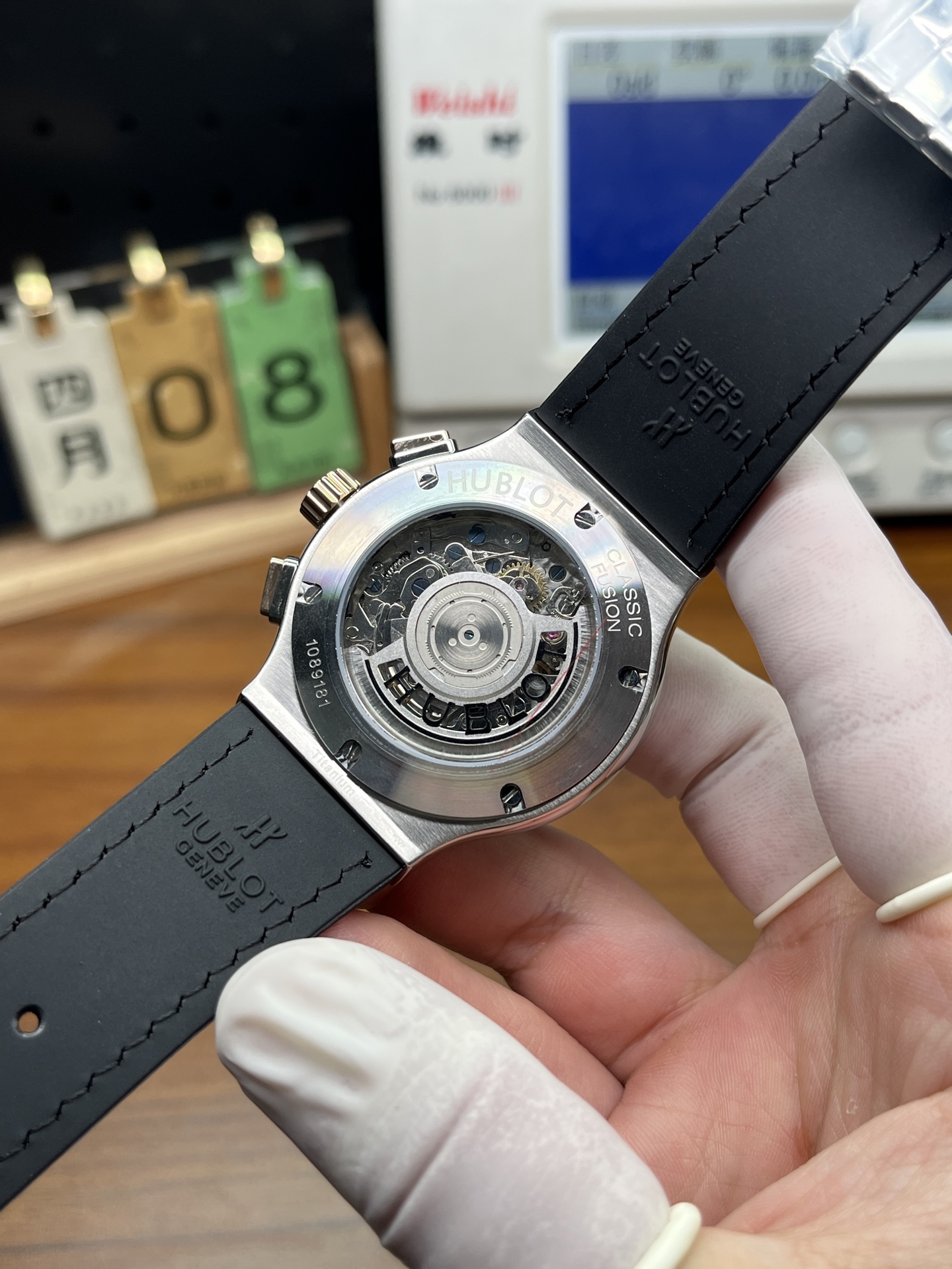 Hublot replica exhibition caseback showing decorated automatic movement and black rubber strap