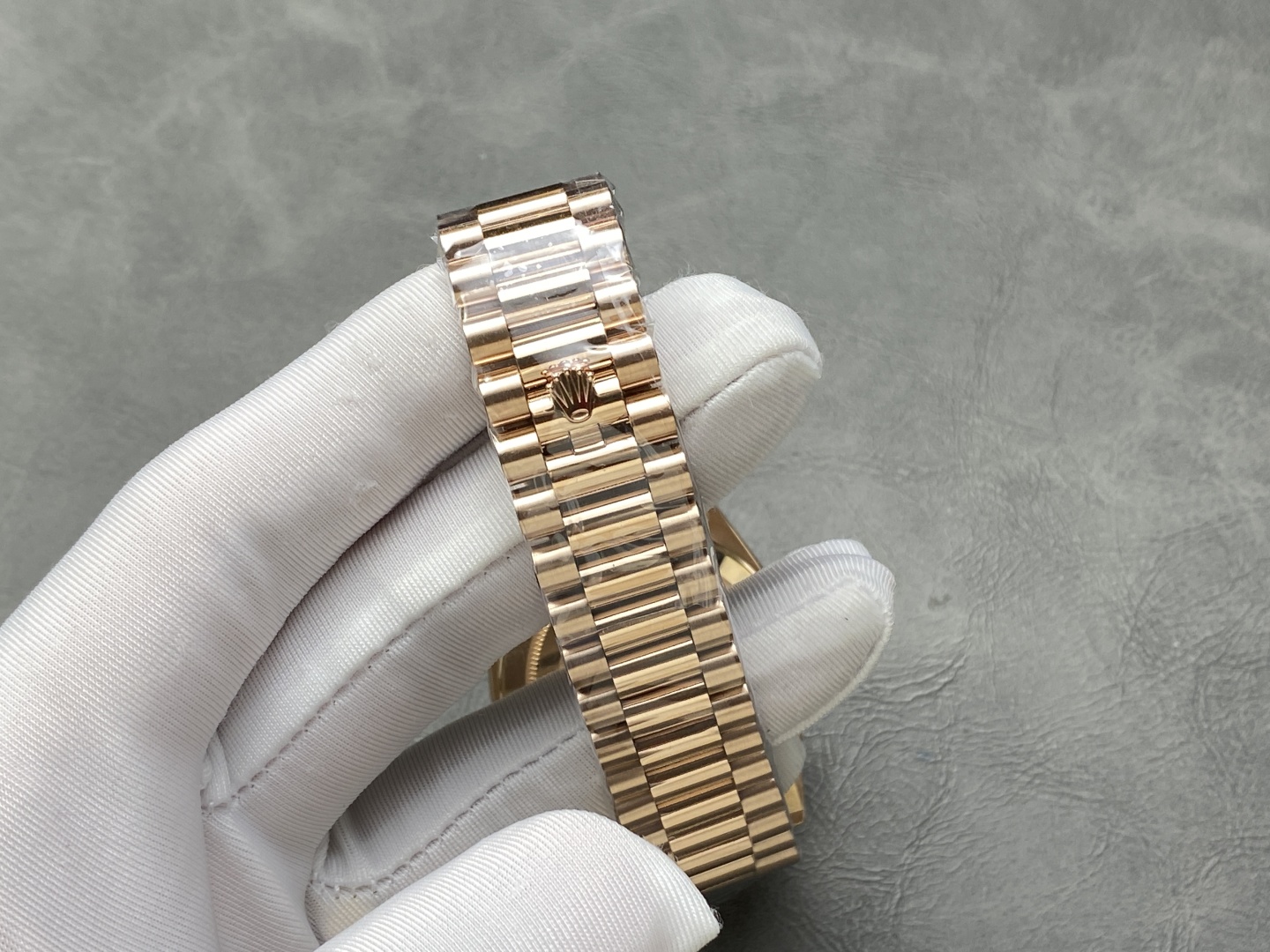Rose gold Rolex Day-Date replica President bracelet clasp and crown logo detail