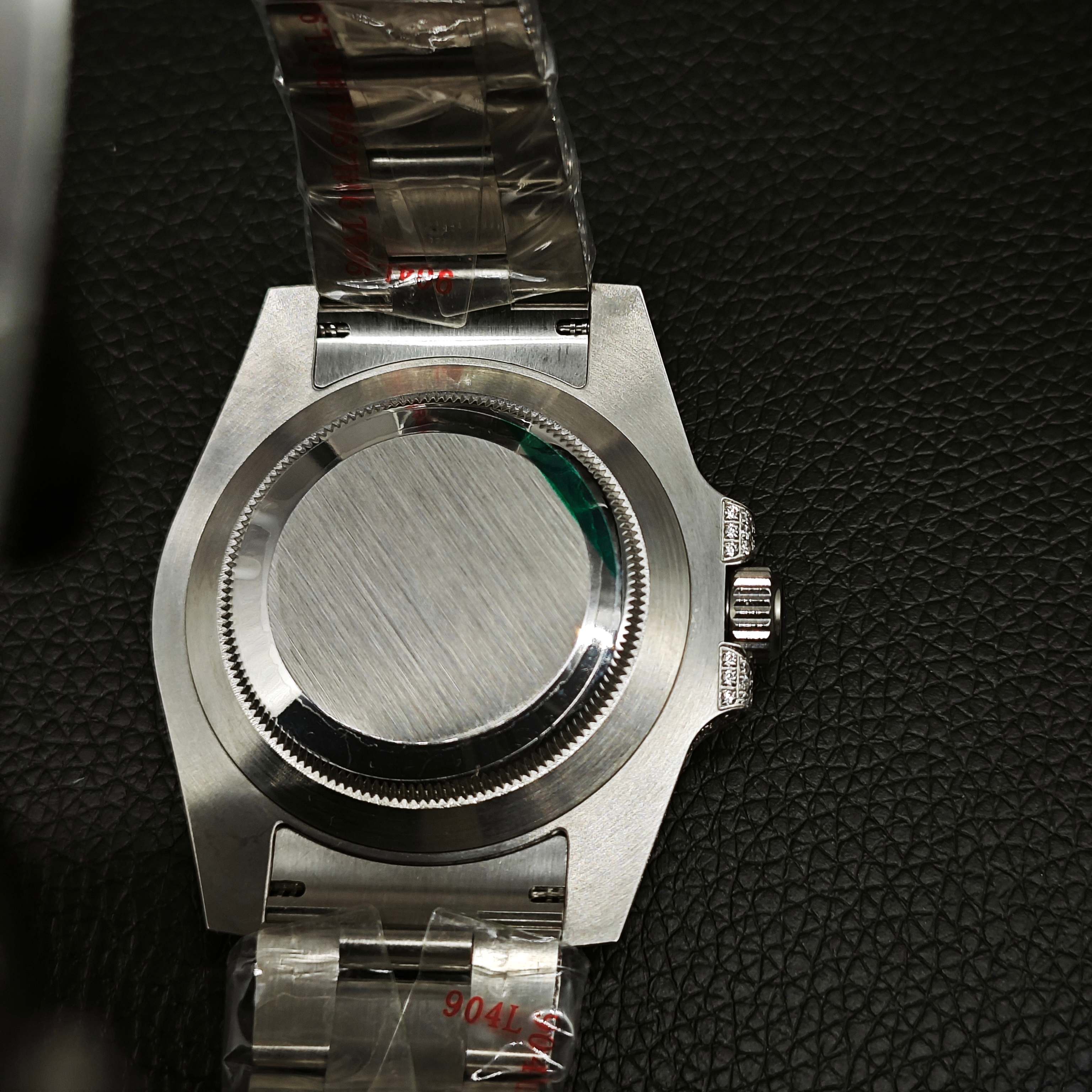 Rolex super clone caseback view with brushed steel back and protected bracelet
