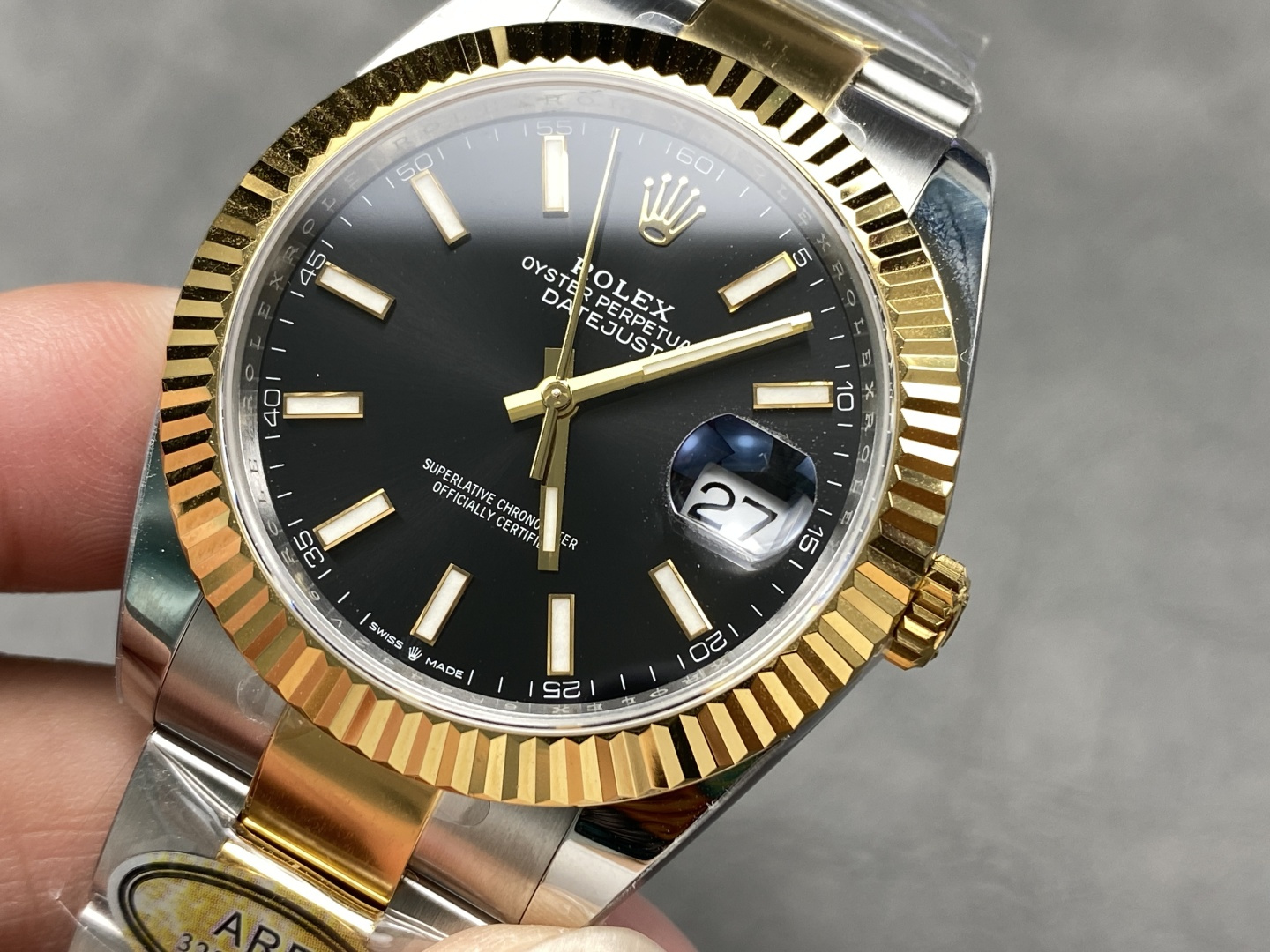 Rolex Datejust 41 black dial gold stick markers close-up