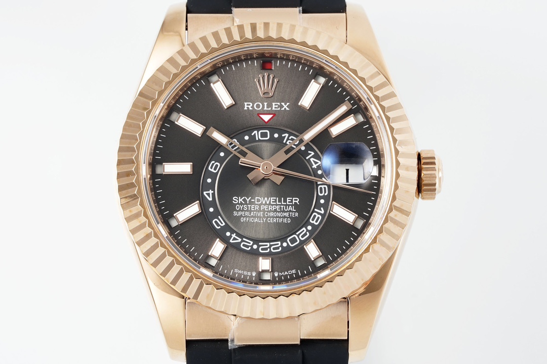 Front dial view of a black and gold Rolex Sky-Dweller replica showing the date and 24-hour indicator