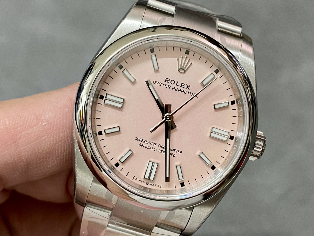 Close-up of pink dial Rolex Oyster Perpetual replica with silver baton indices and hands