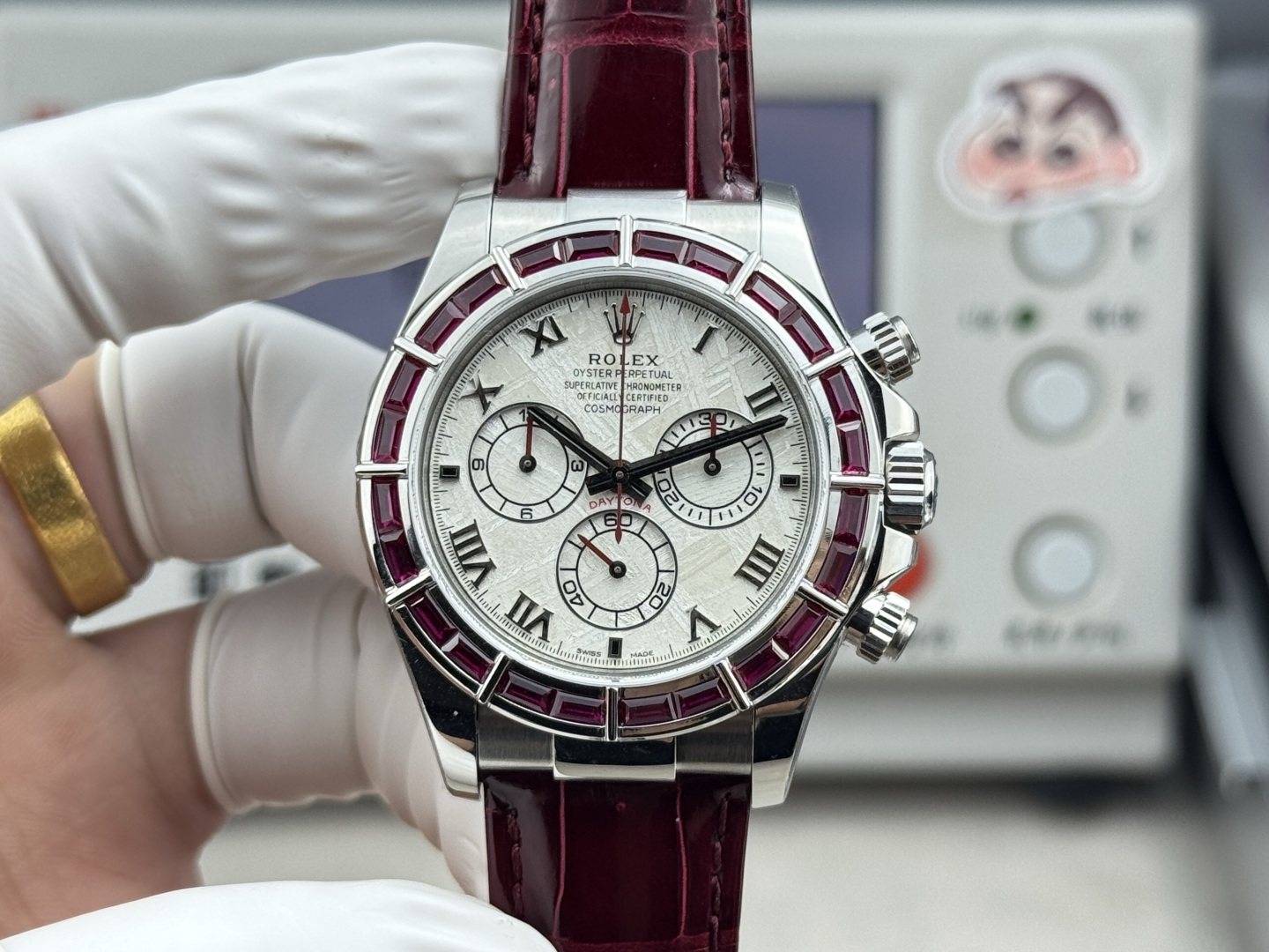 Rolex Daytona replica dial with meteorite style texture and ruby bezel