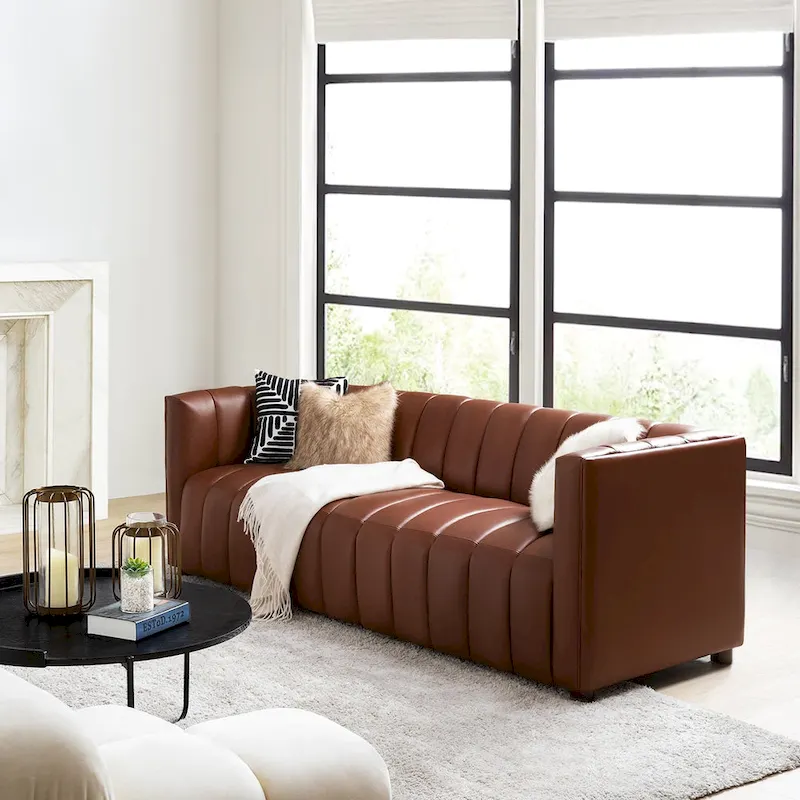 83-inch genuine leather curved sofa with a grooved backrest.