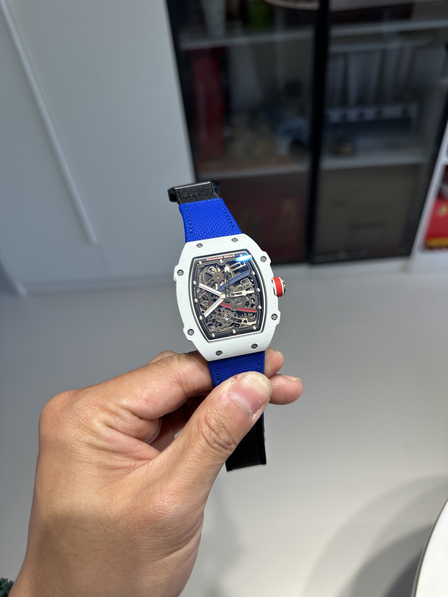 Replica Richard Mille watch front view with blue strap and skeleton dial