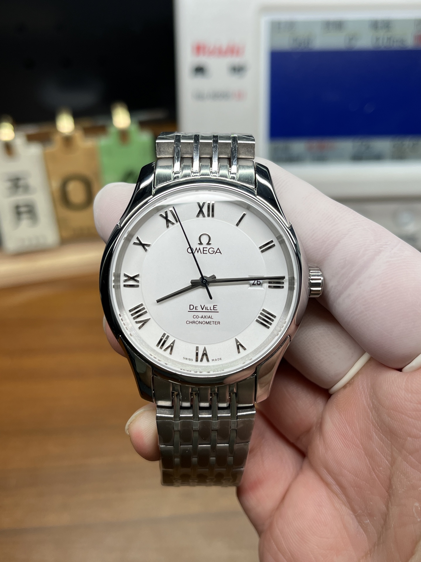 Omega De Ville replica front dial with Roman numerals and steel bracelet