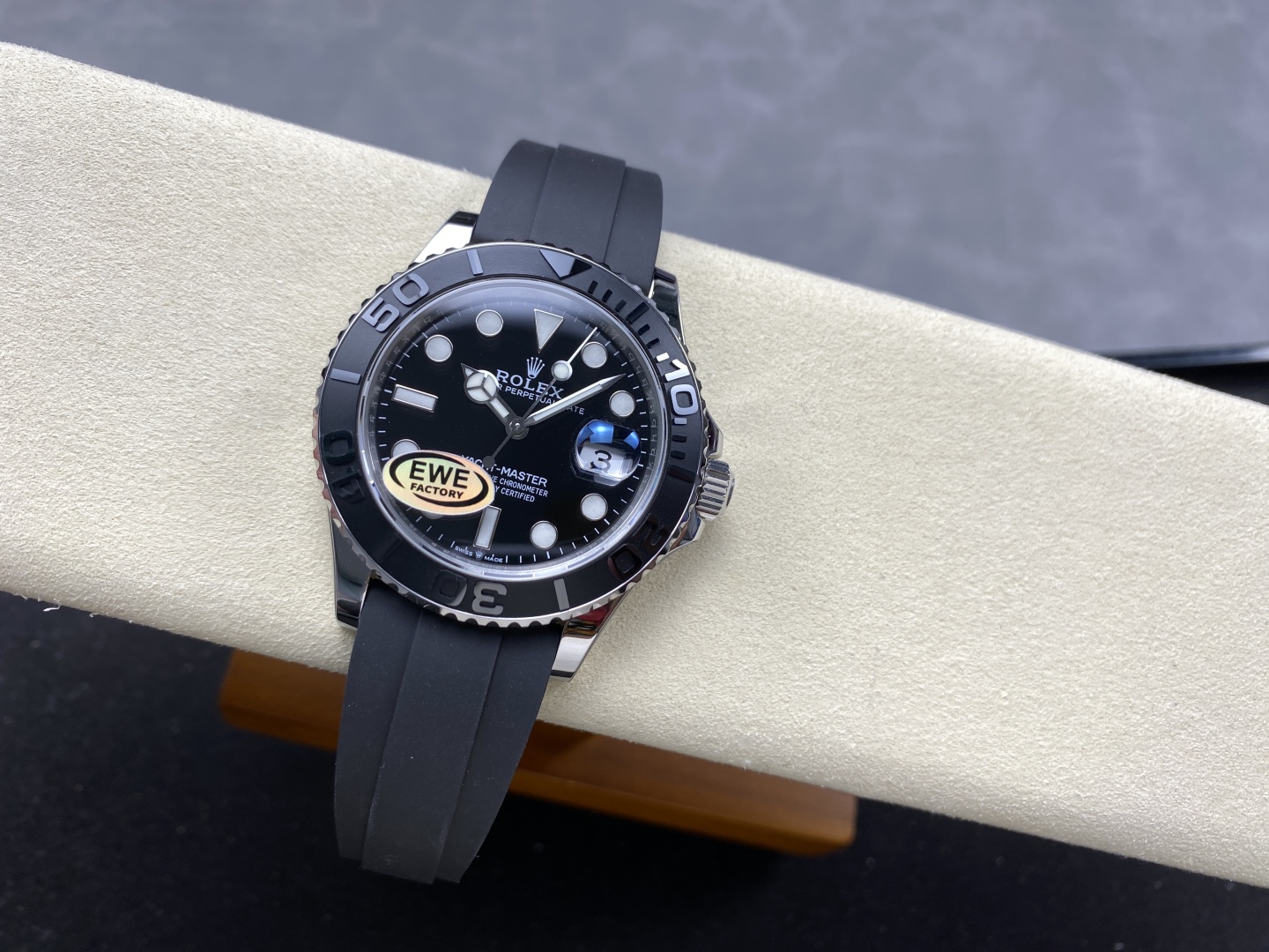 High-end replica Rolex Yacht-Master with black dial and rubber strap on display