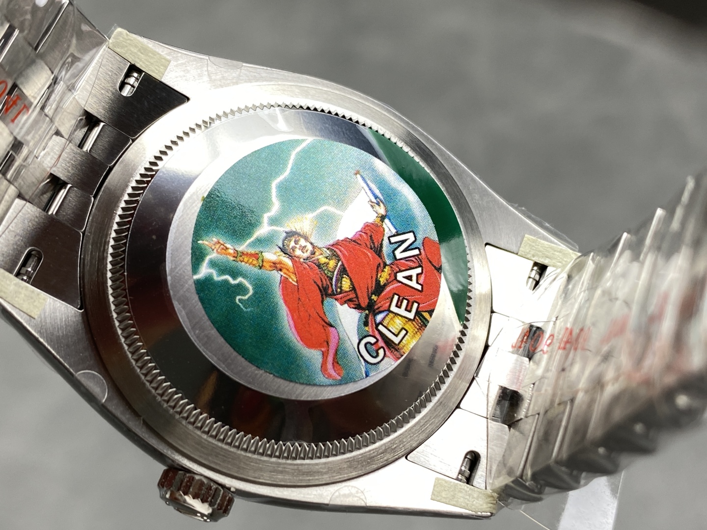 Caseback of a Clean Factory Datejust 41 with the signature lightning goddess sticker