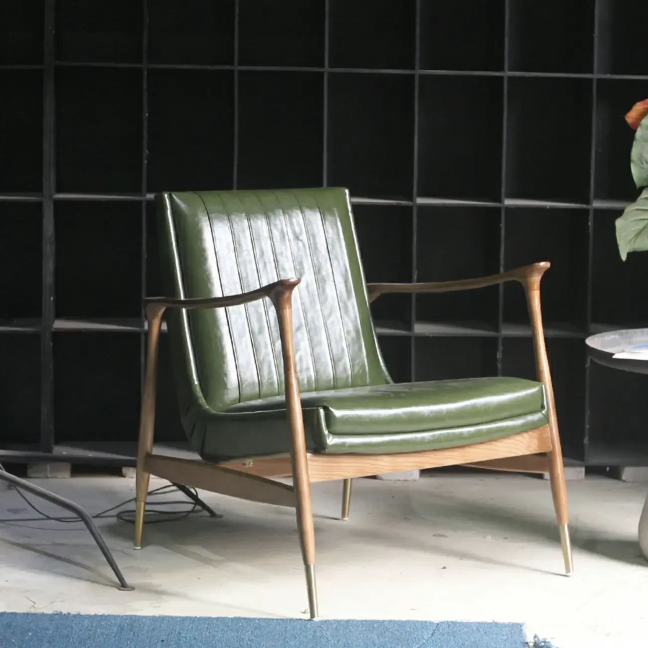 Modern Green Leather Armchair with High Back Design