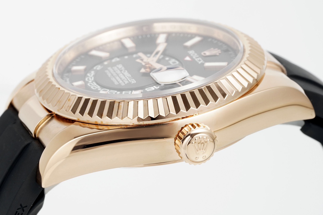 Close-up side angle of a rose gold fake Rolex Sky-Dweller super clone highlighting the fluted bezel and crown