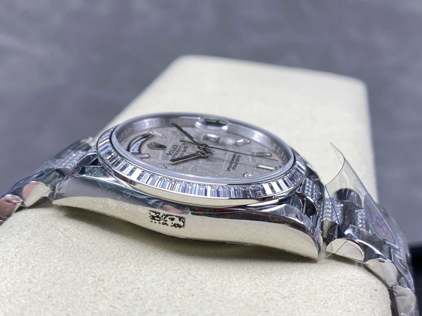 Side profile of the silver diamond bezel replica watch