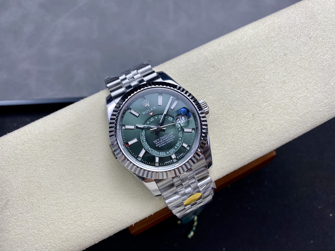 Best replica Rolex Sky-Dweller green dial with steel bracelet and fluted bezel on display