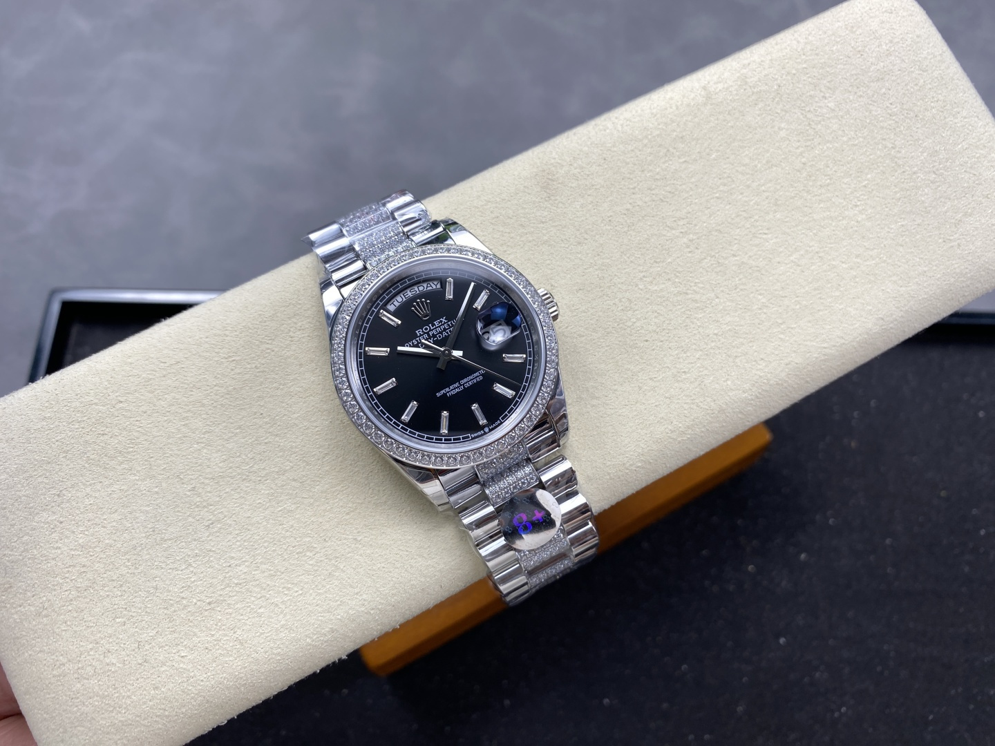 Rolex Day-Date super clone replica front view with black dial and diamond bezel