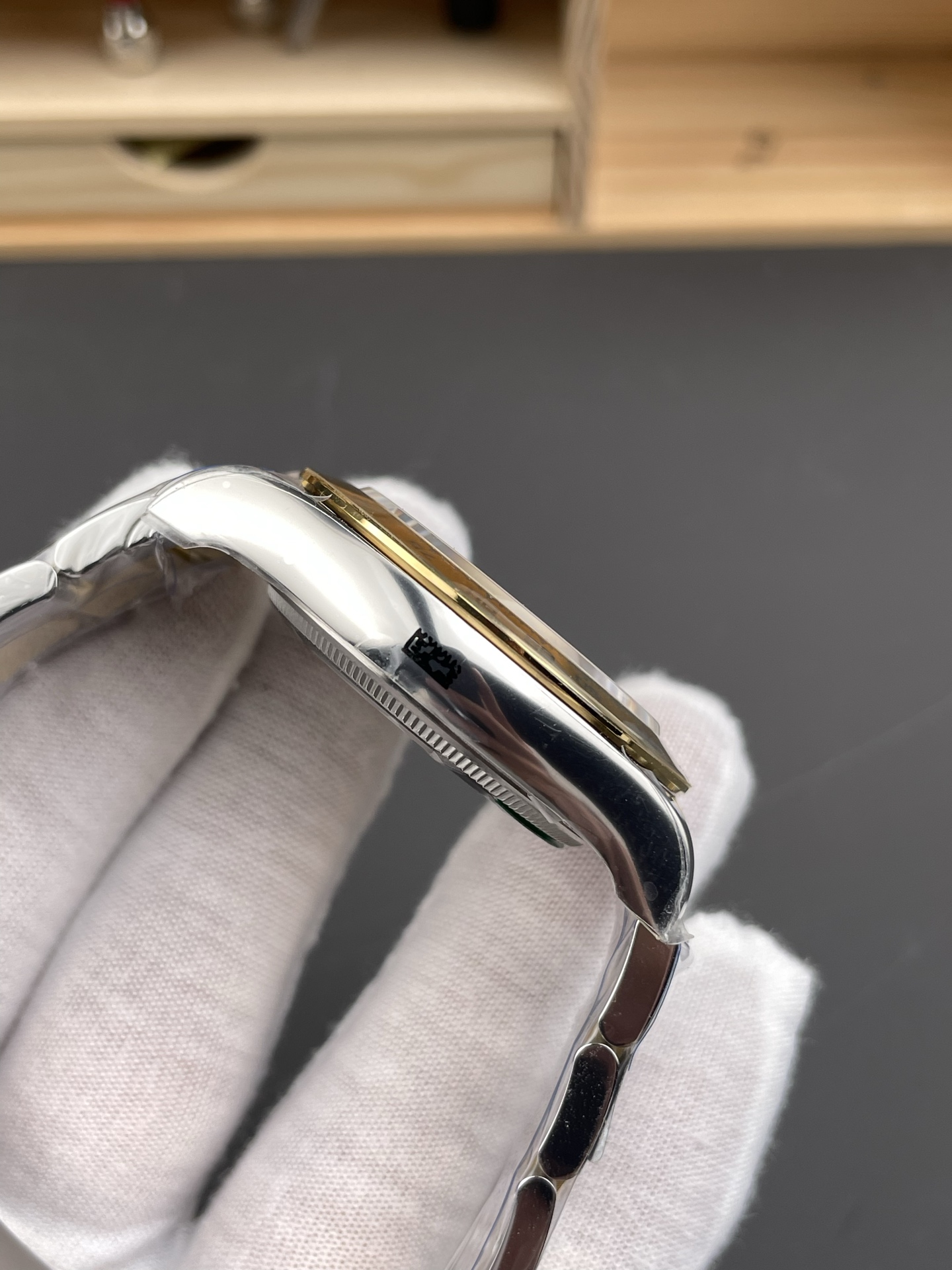 Side view highlighting the precision engineering of the replica watch case and bracelet