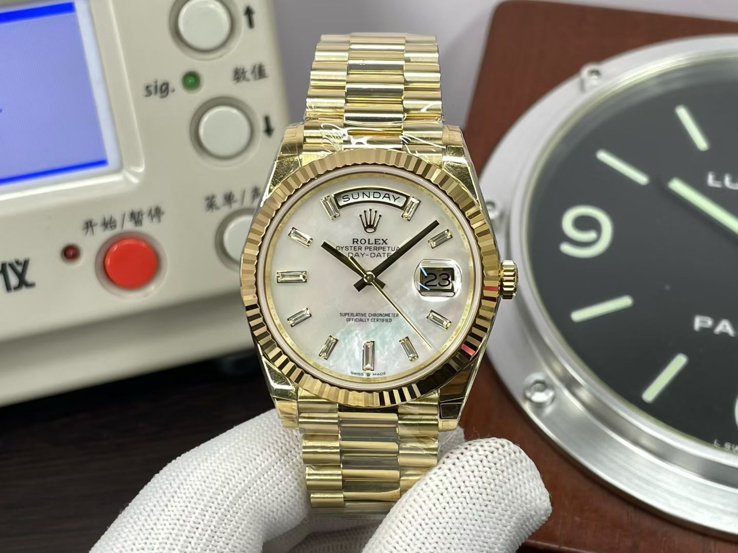 Gold Rolex Day-Date replica front view with white dial and fluted bezel