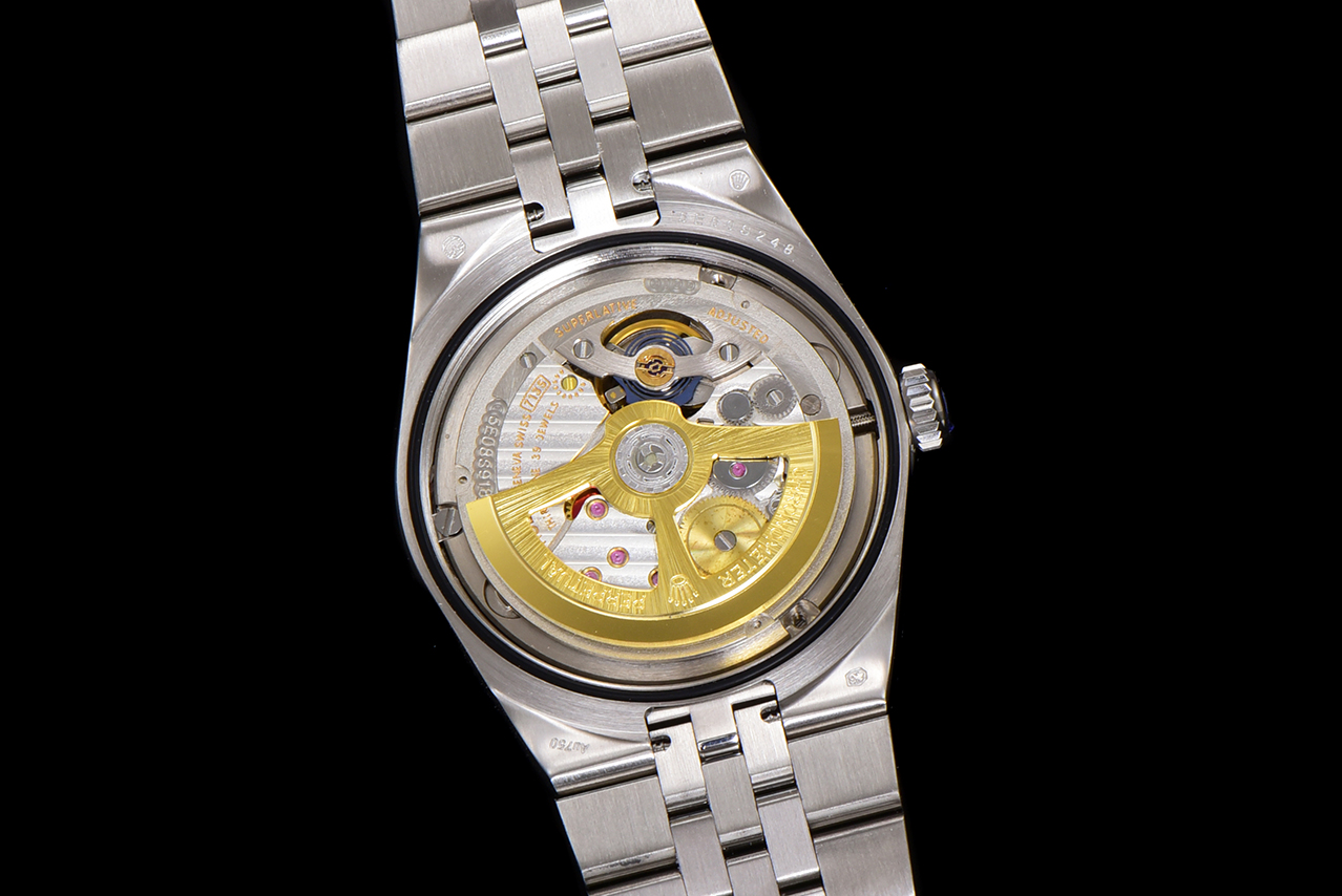 Exhibition caseback showing automatic replica Rolex movement and gold rotor