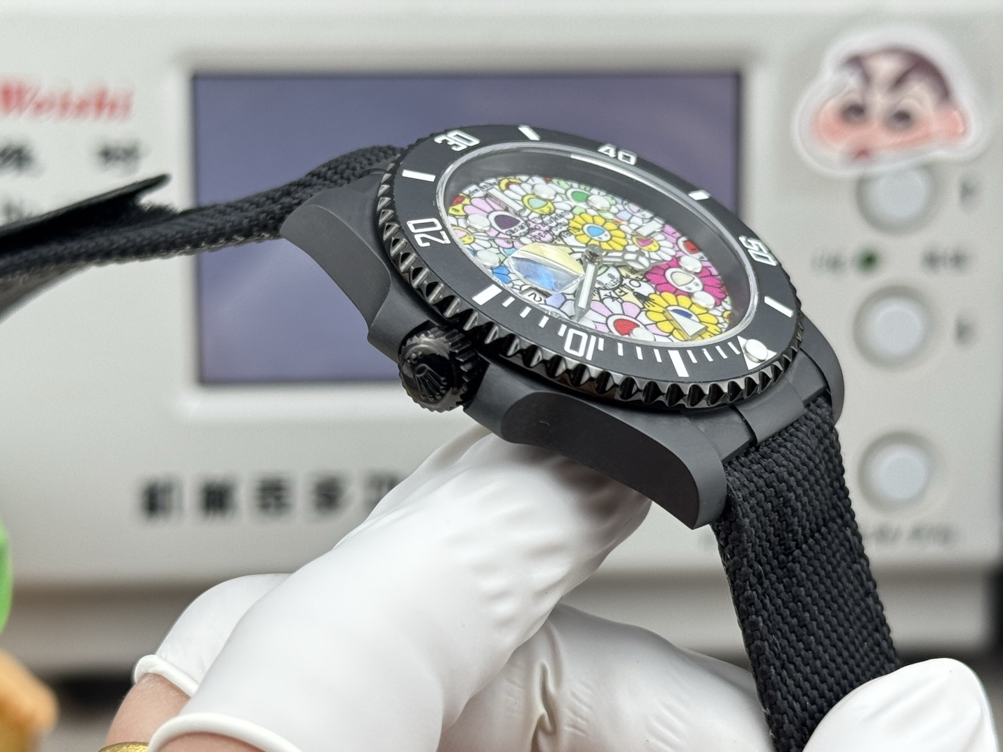 Side profile of black DLC Rolex Submariner replica showing the bezel, crown, and case thickness.
