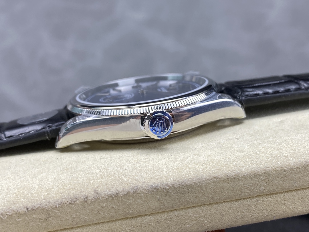 Rolex 1908 replica side view showing fluted bezel and blue crown