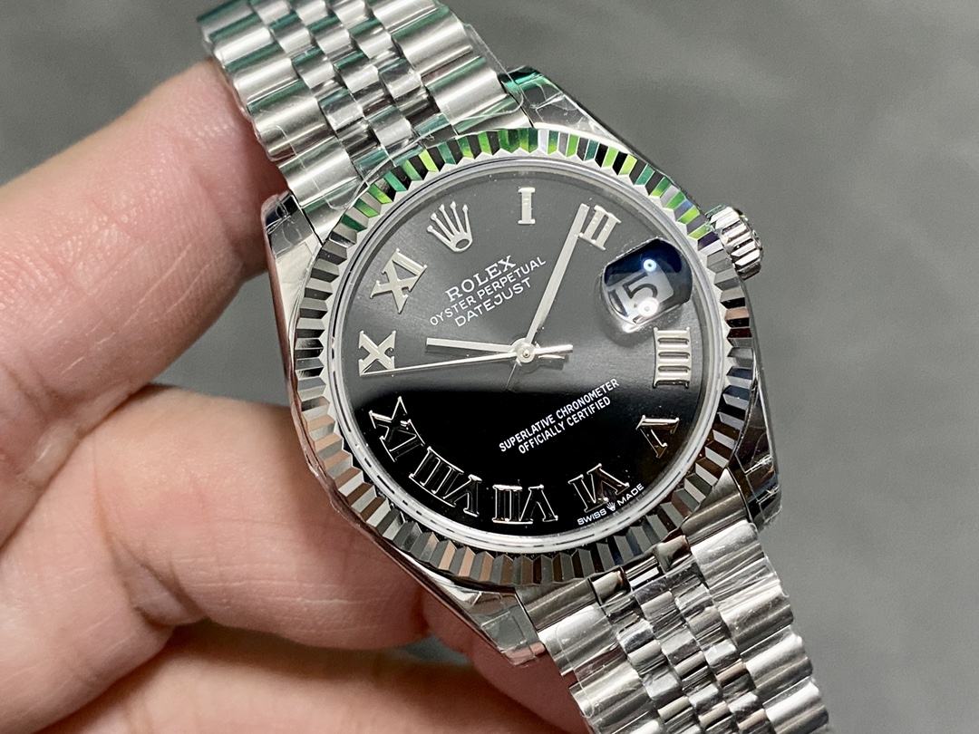 Replica Rolex Datejust black dial roman numerals jubilee bracelet worn on wrist