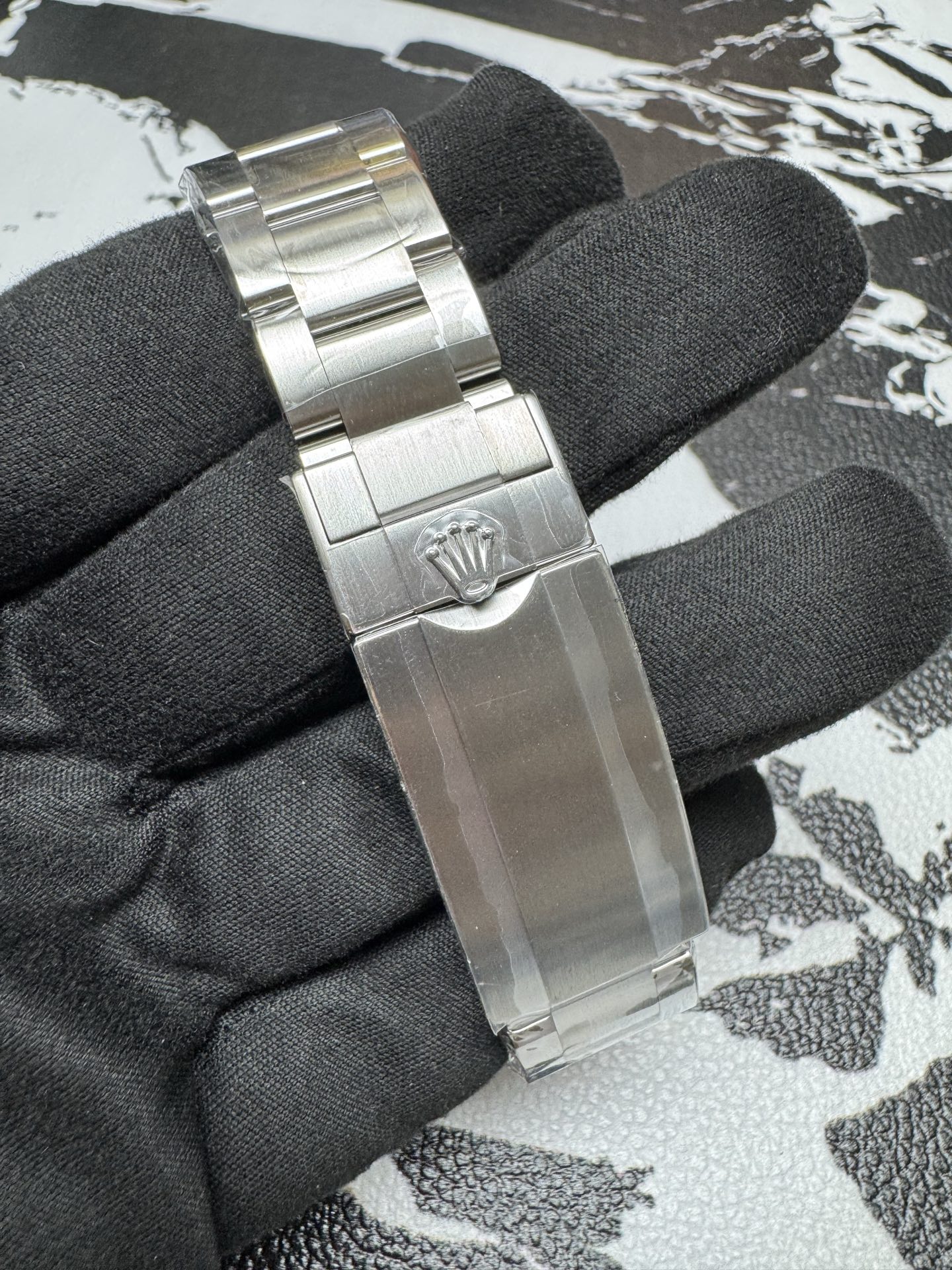 Replica Rolex Oyster bracelet clasp with engraved crown and STEELINOX text