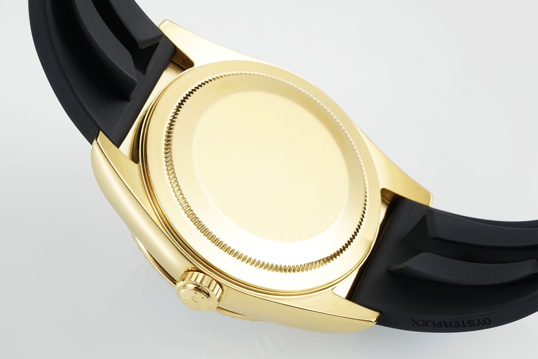 Caseback view of a gold replica Sky-Dweller with a solid gold screw-down back