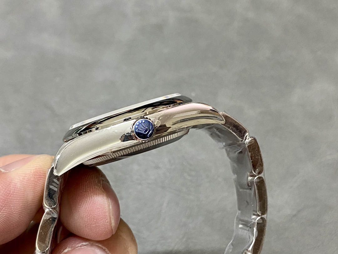 Side profile of Rolex Oyster Perpetual super clone showing crown and case thickness
