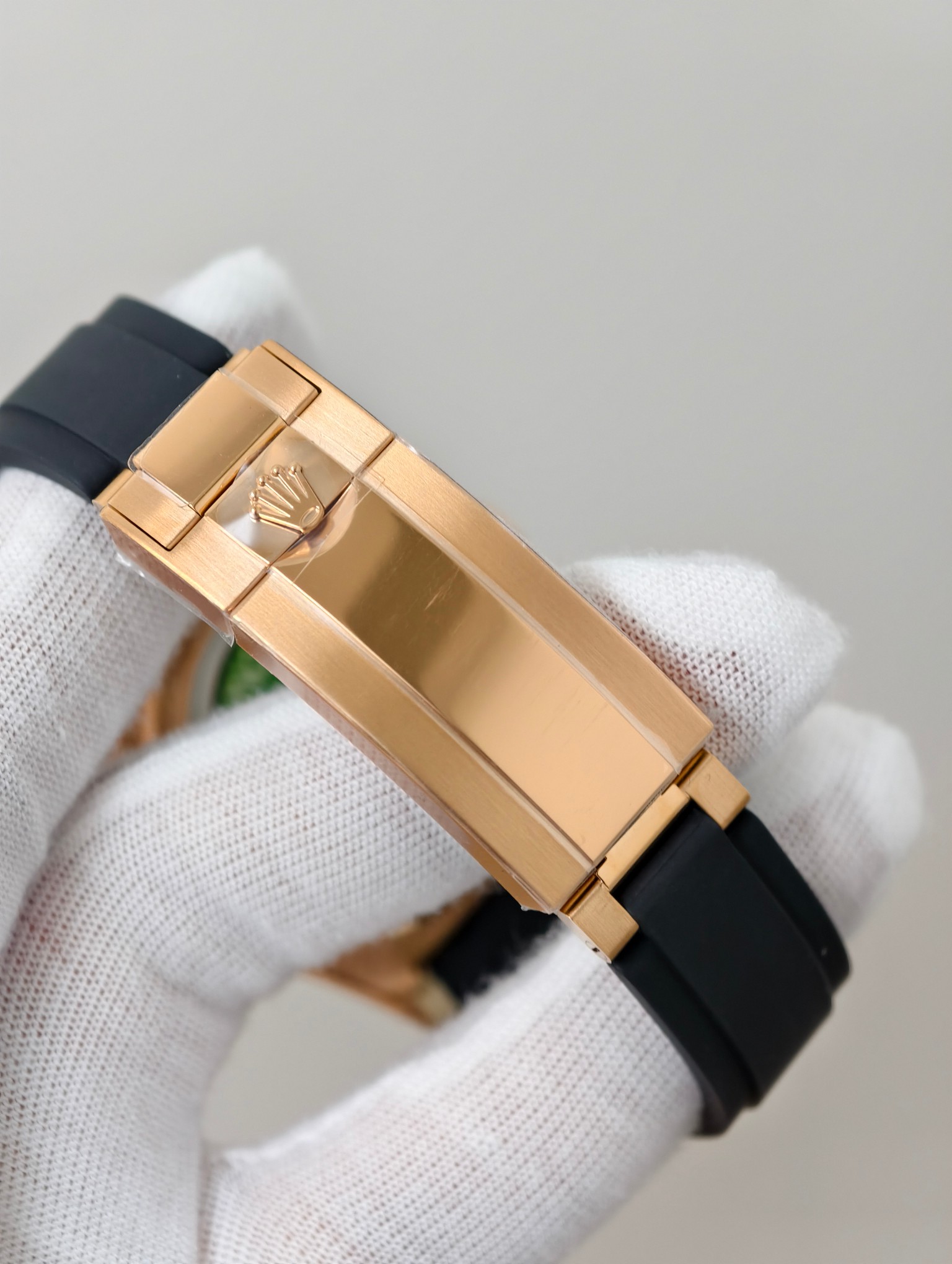 Close-up of diamond-set hour markers on black dial of premium Daytona replica