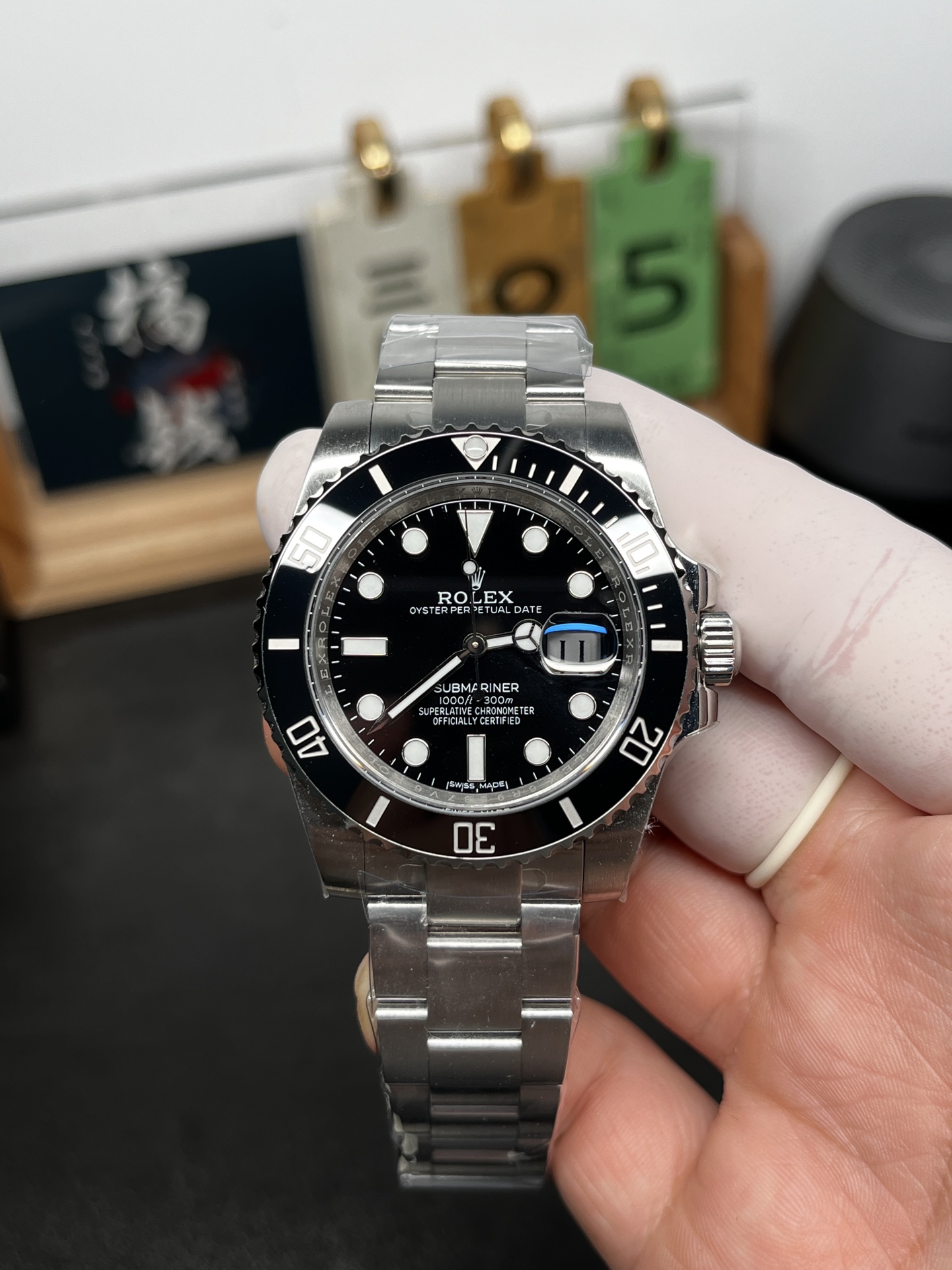 Black dial Rolex Submariner replica front view with cyclops date magnifier