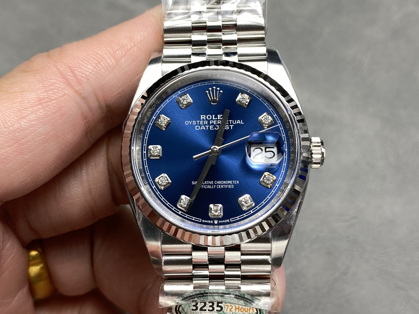 Close-up of the blue sunburst dial and diamond hour markers on a Clean Factory Datejust 41