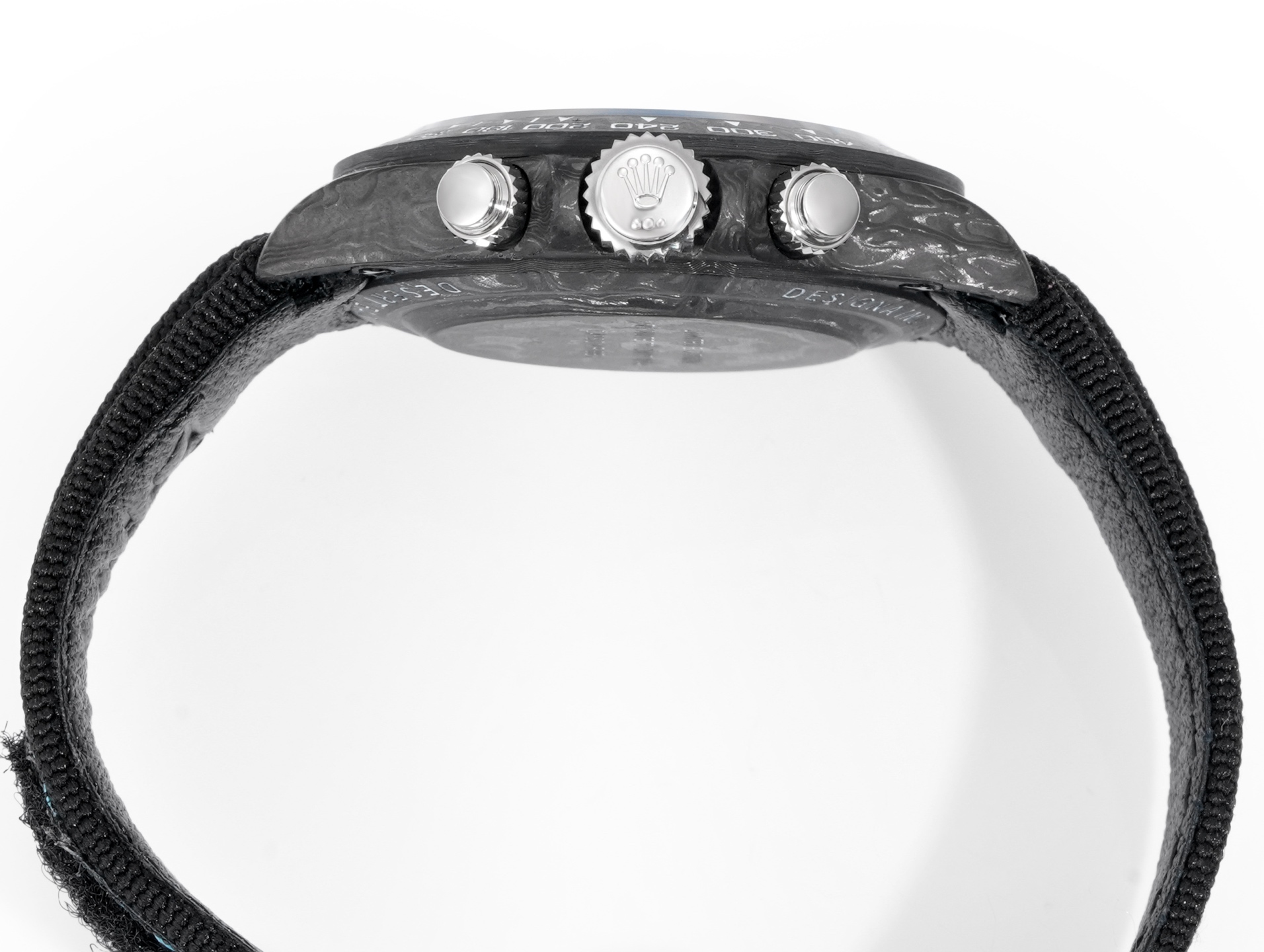 Profile view of Rolex crown and chronograph pushers on carbon fiber super clone