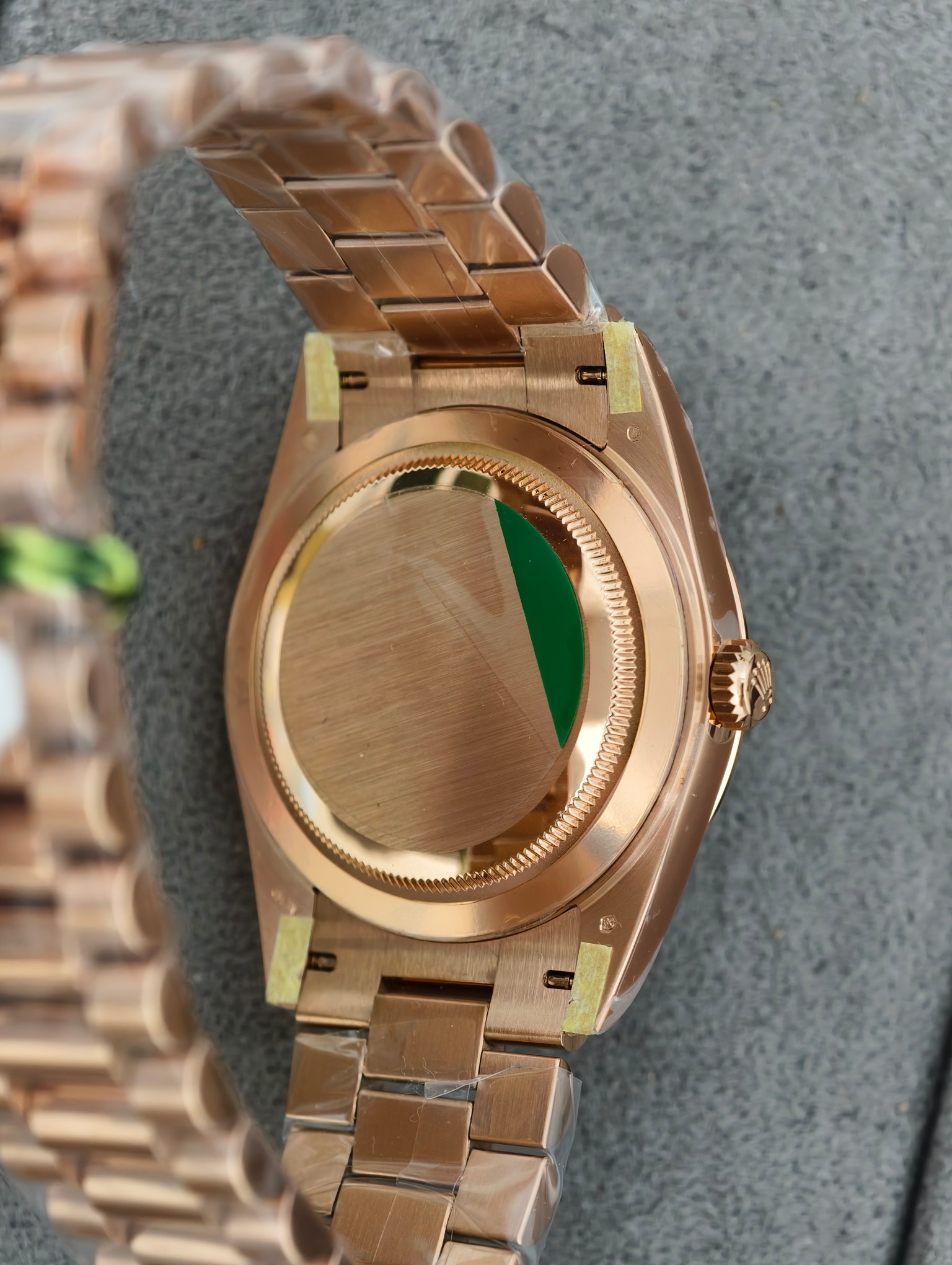 Caseback view of the rose gold Rolex replica showing brushed finish and authenticity details