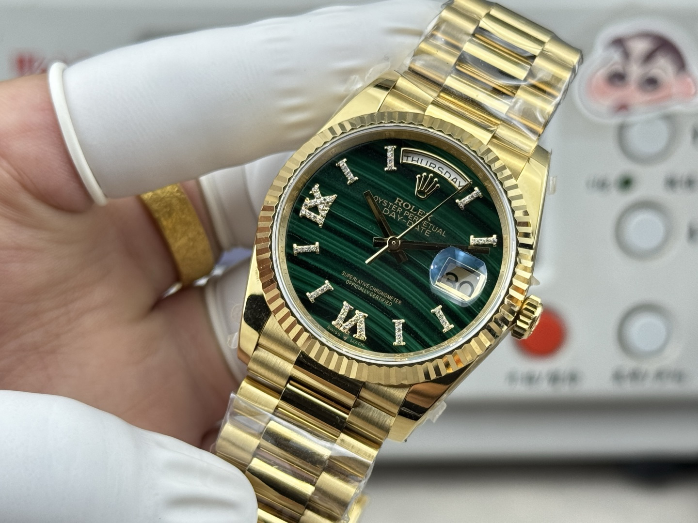 Gold Rolex Day Date replica with green diamond dial and President bracelet