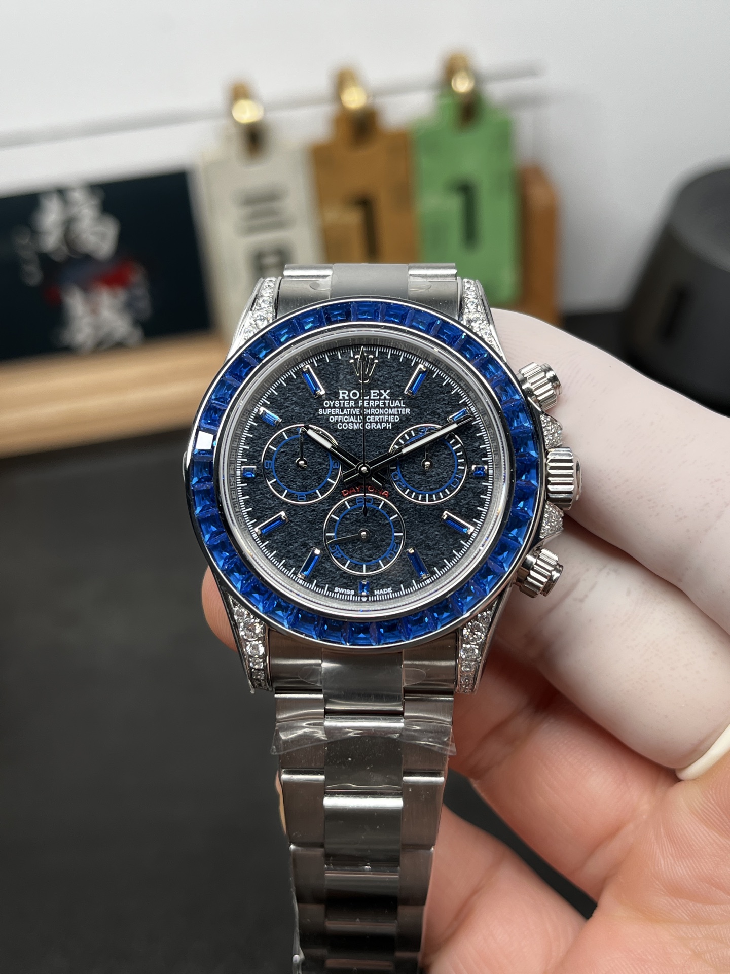 Front view of blue bezel Rolex Daytona super clone watch with steel bracelet
