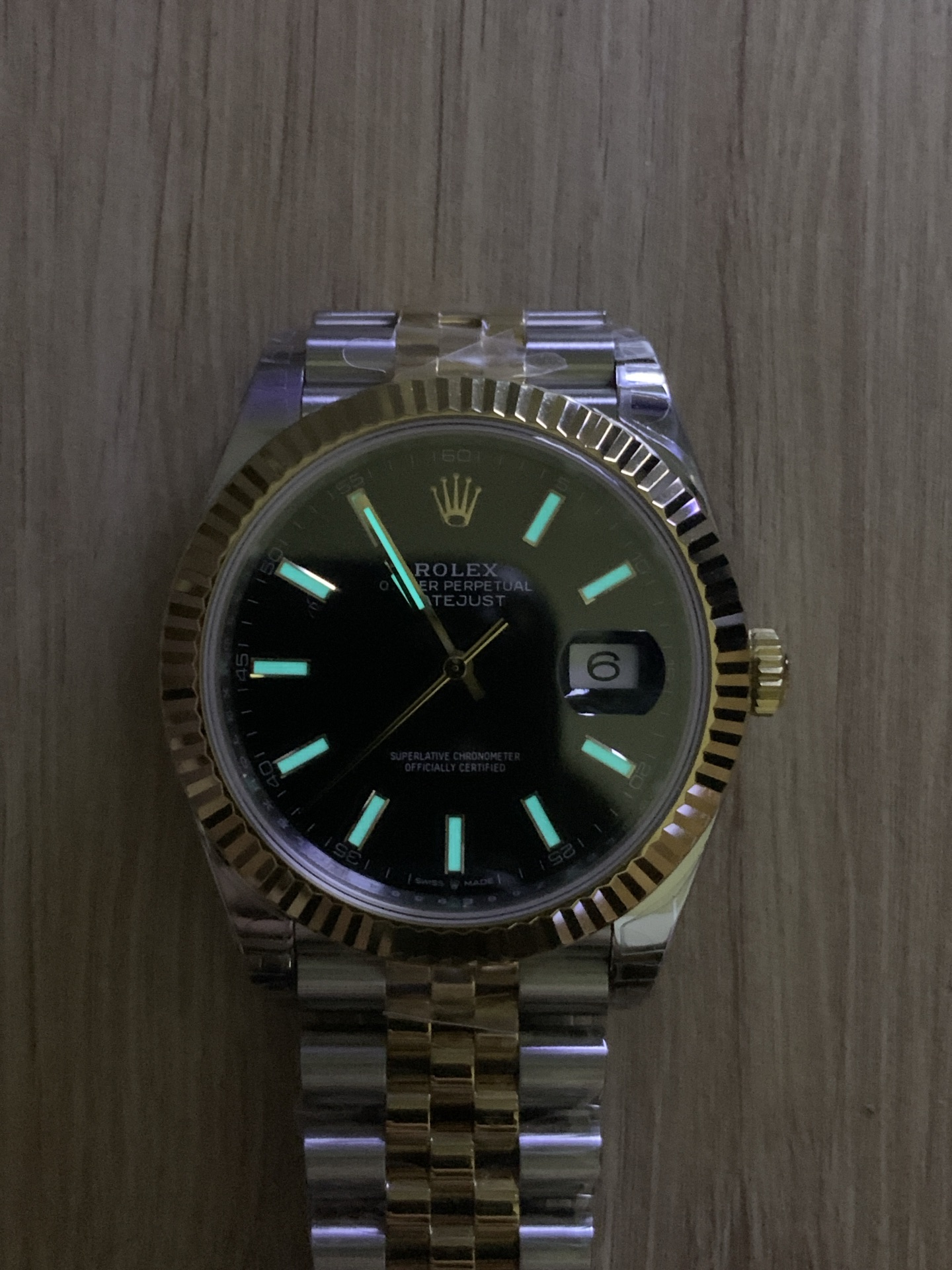Premium Rolex Datejust replica with black sunburst dial, fluted gold bezel and two-tone Oyster bracelet